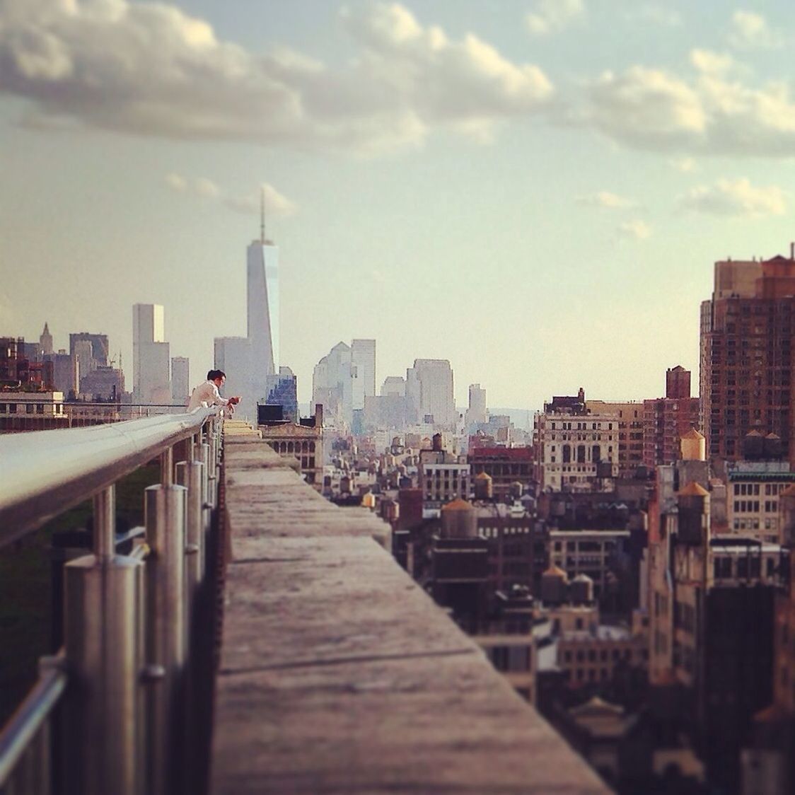 Man standing on terrace in city