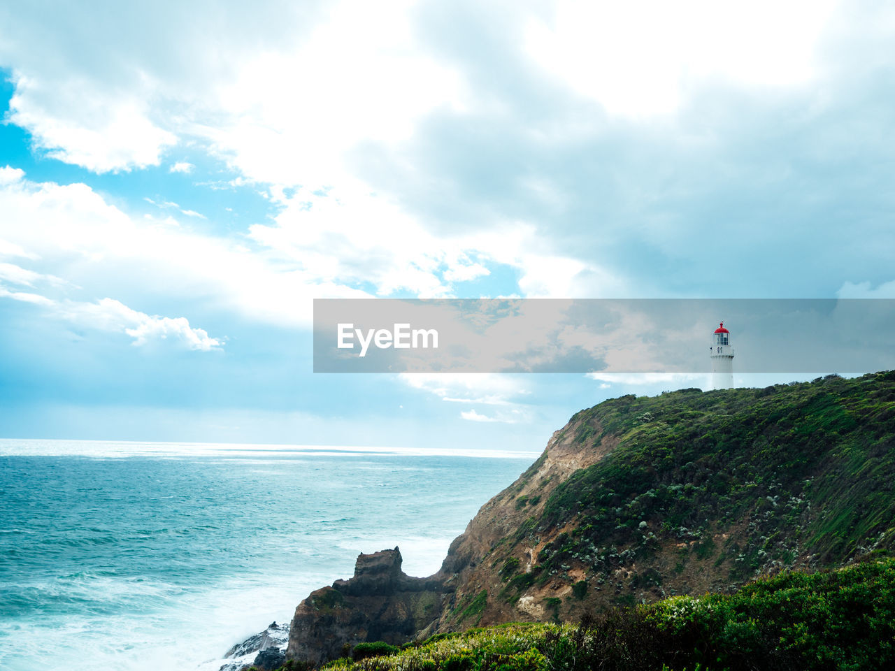 Scenic view of sea against cloudy sky