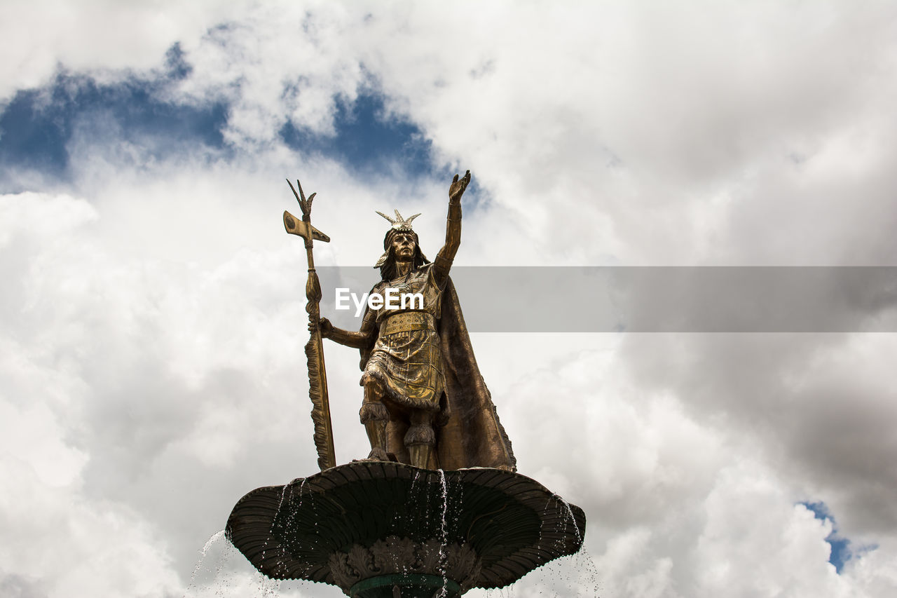 Low angle view of statue against sky