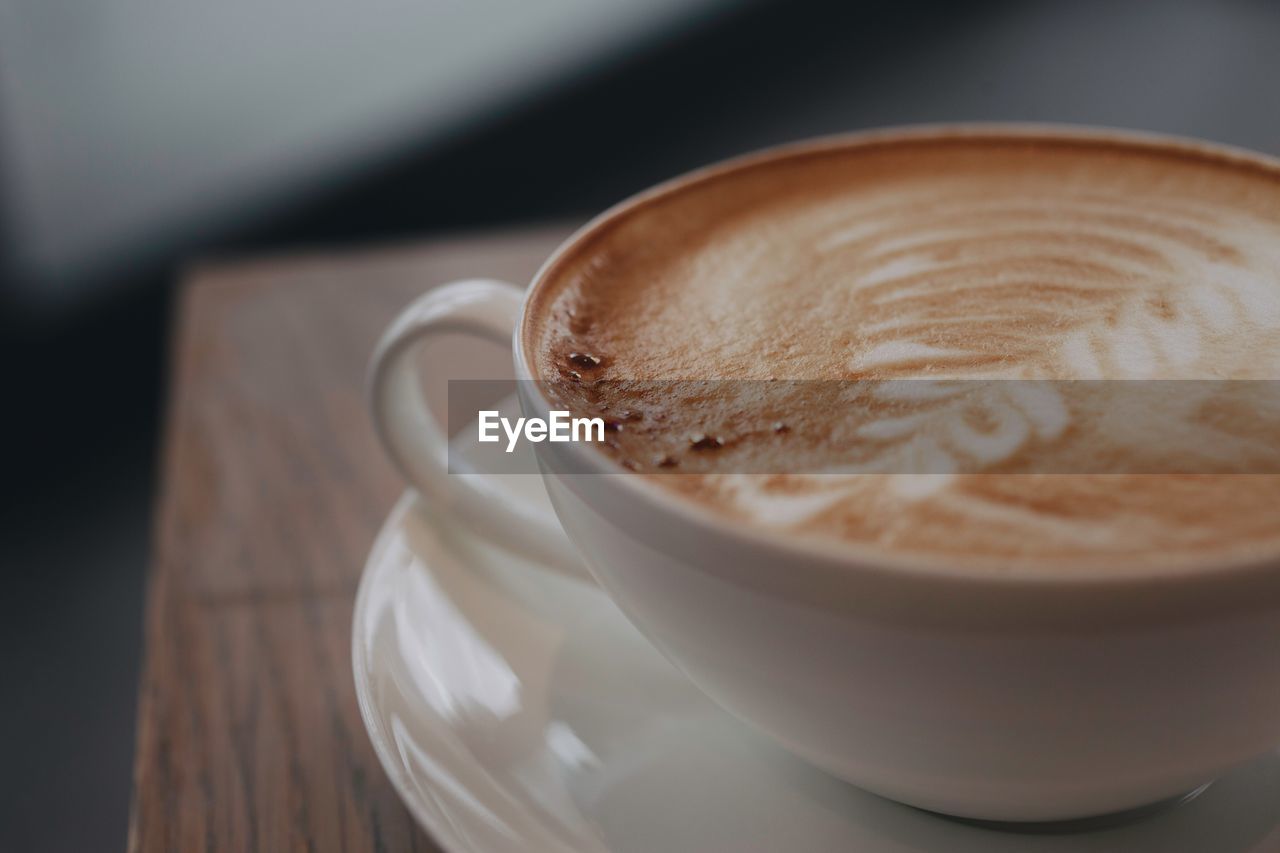 Close-up of cappuccino on table