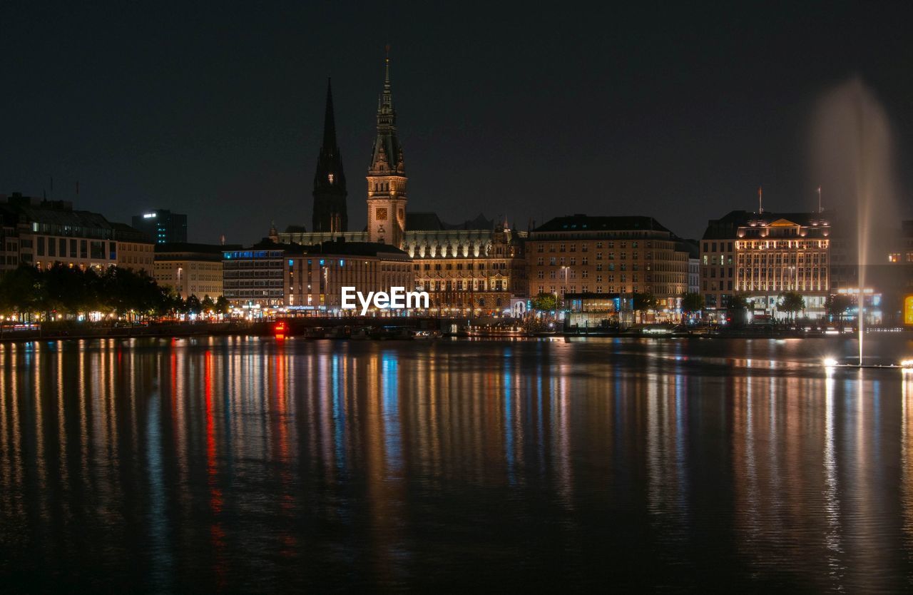 Reflection of illuminated buildings in water at night