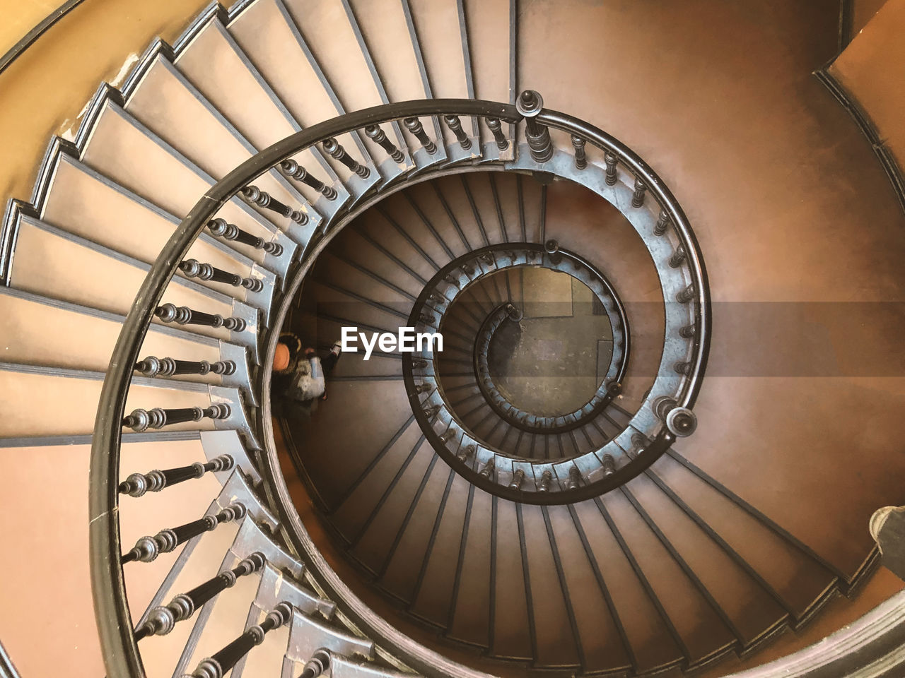 staircase, spiral, spiral staircase, steps and staircases, railing, architecture, stairs, built structure, indoors, high angle view, directly above, aircraft engine, wheel, curve, diminishing perspective, circle, no people, pattern