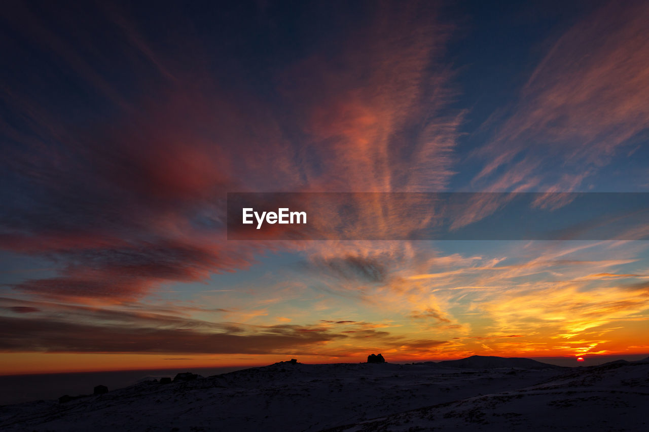 Scenic view of dramatic sky during sunset