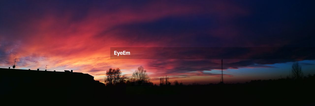 SCENIC VIEW OF SILHOUETTE LANDSCAPE AGAINST SKY DURING SUNSET