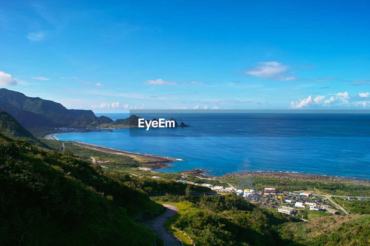 Scenic view of sea against blue sky