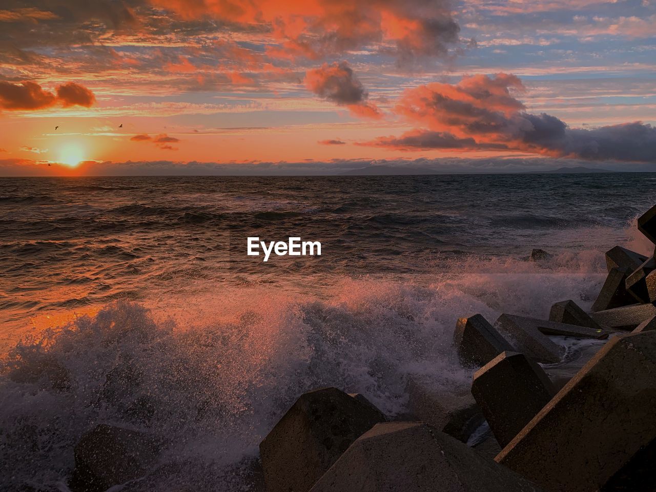 Scenic view of sea against sky during sunset