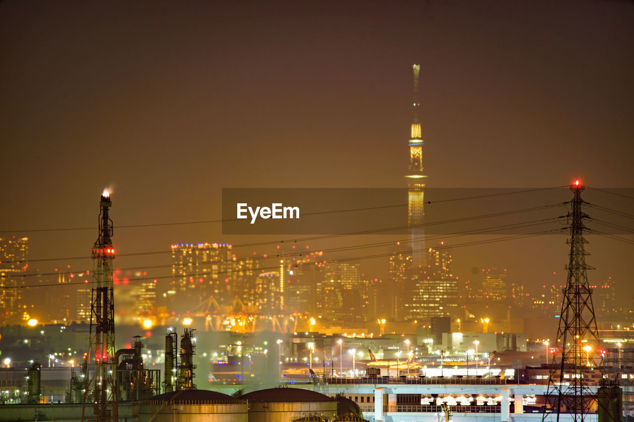 VIEW OF ILLUMINATED BUILDINGS AT NIGHT