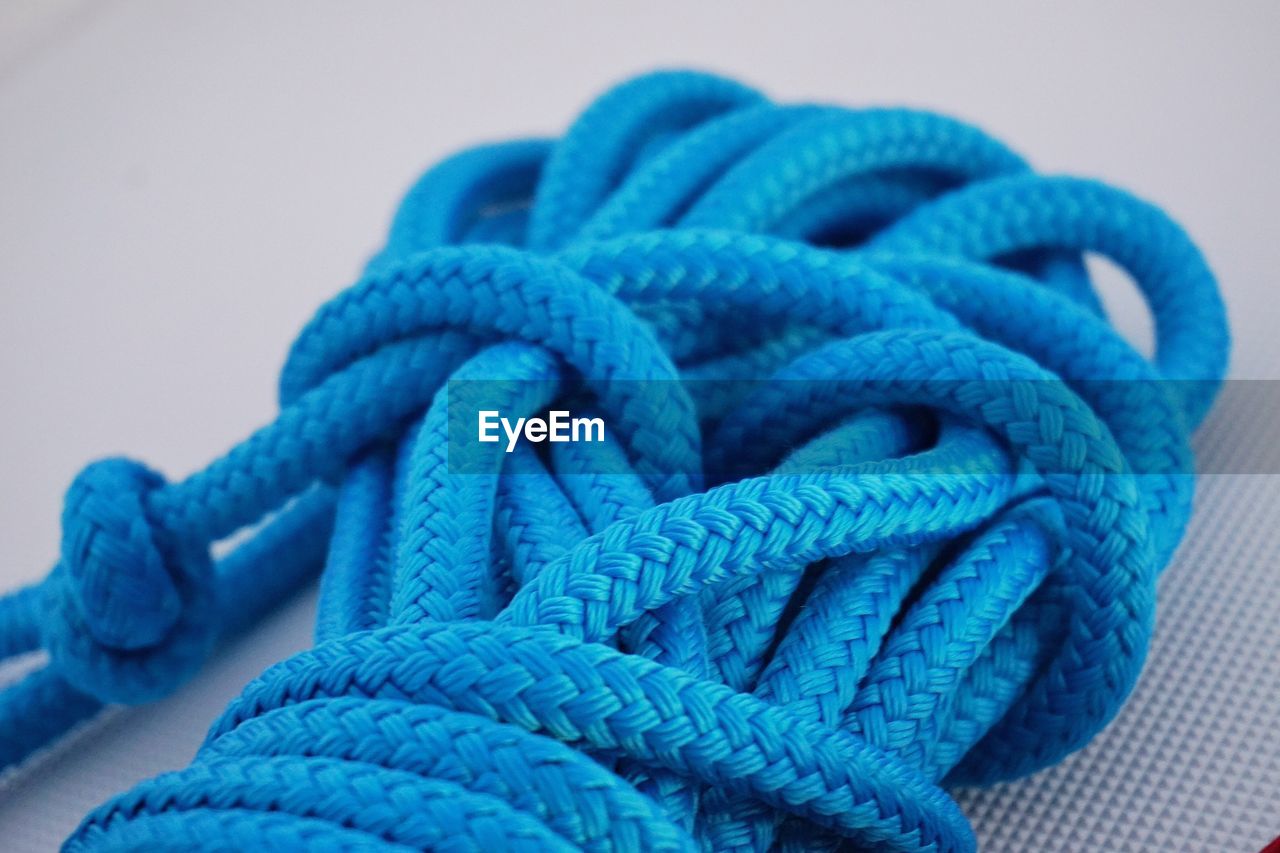 Close-up of blue rope on table