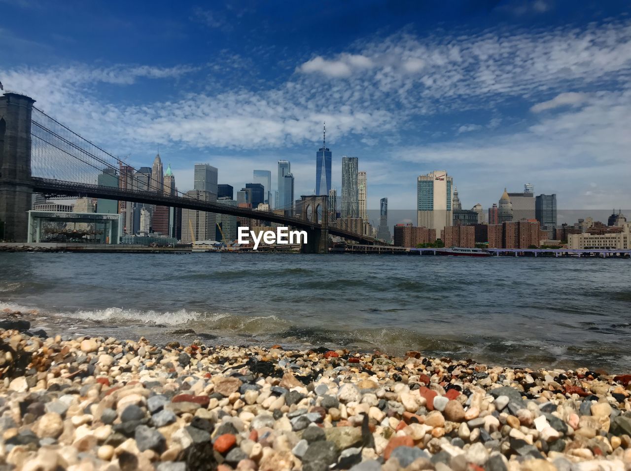 View of sea and buildings against sky