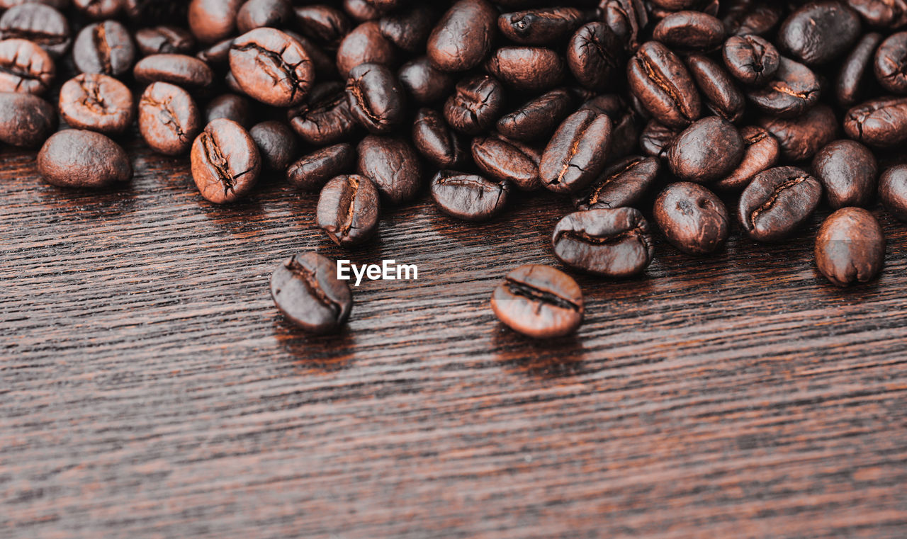 CLOSE-UP OF COFFEE BEANS IN GLASS