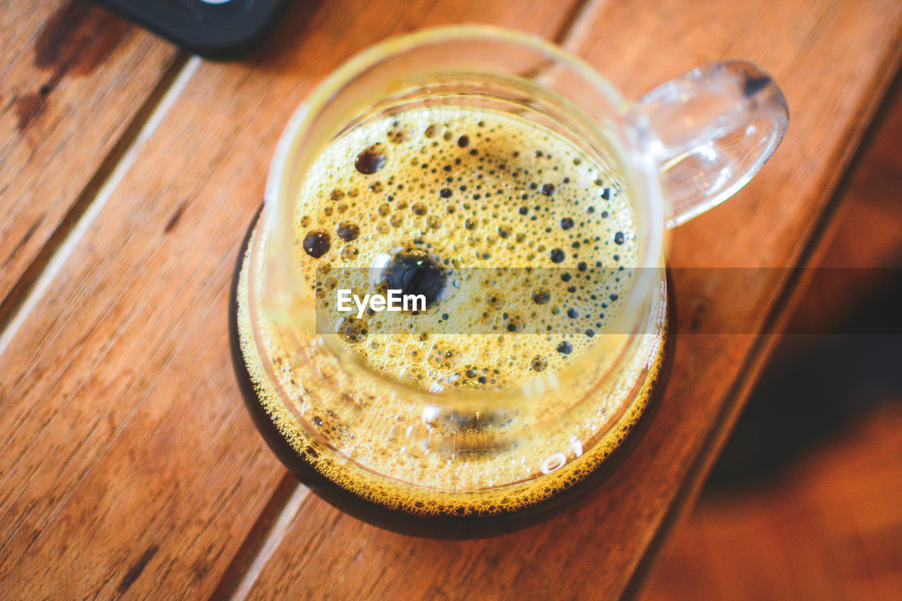 High angle view of coffee cup on table