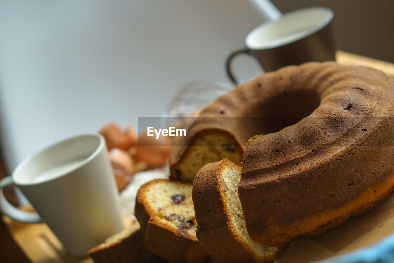 Close-up of coffee cup and cake on table