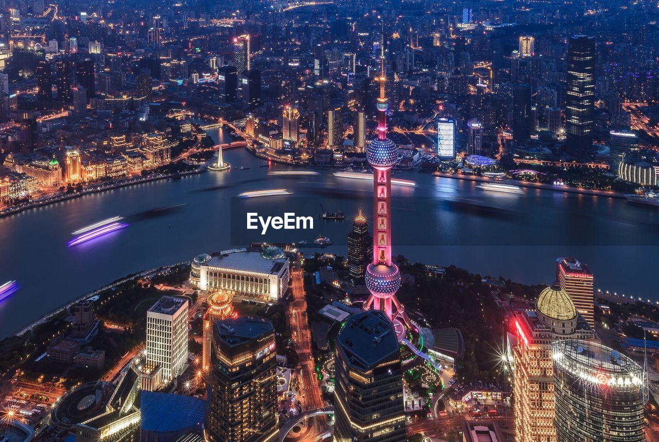 High angle view of oriental pearl tower and huangpu river in city at night