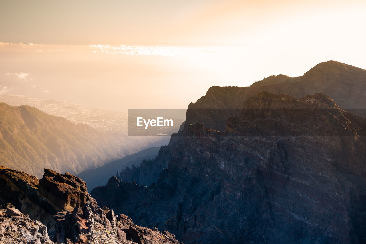 Scenic view of mountains against sky during sunset