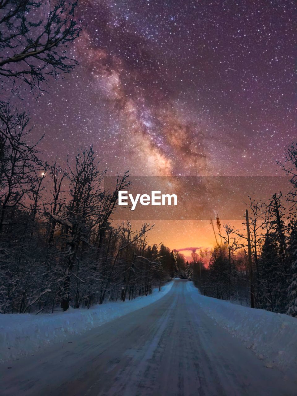 Milky way and snowy road 