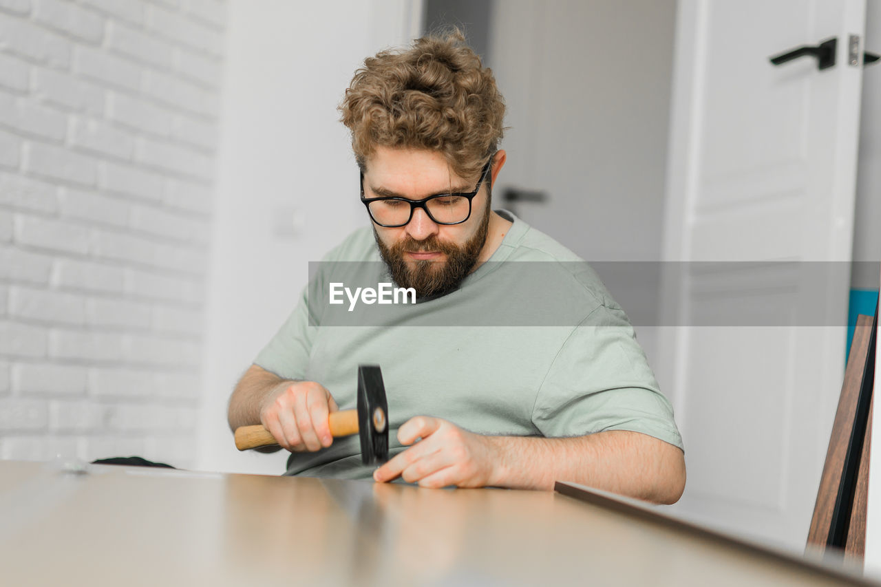 portrait of young man working at desk