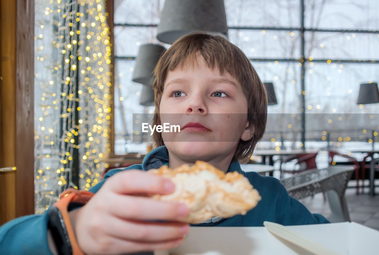 Portrait of boy holding ice cream