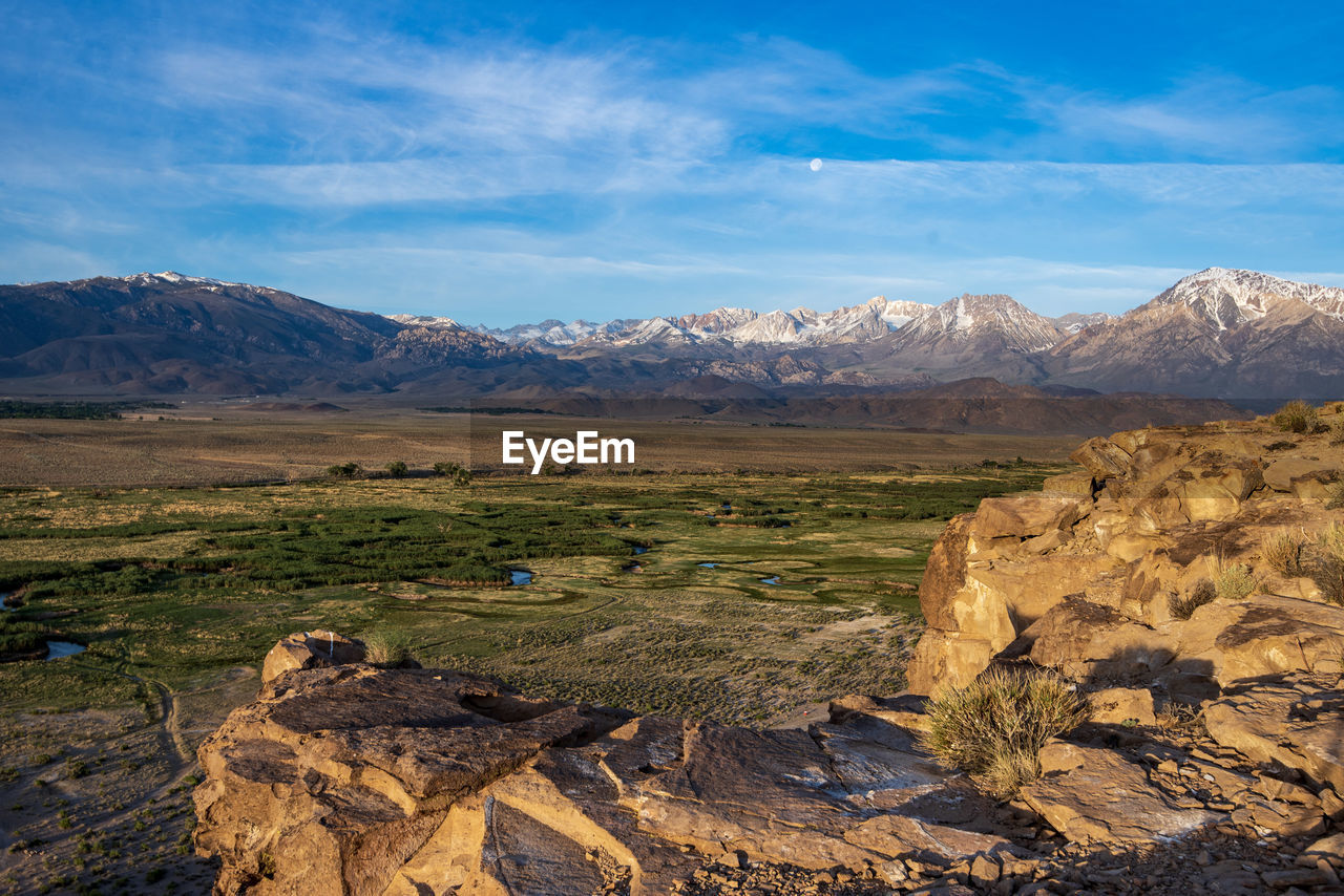 Owens river valley cliff view distant snowy peaks of eastern sierra nevada mountains california usa