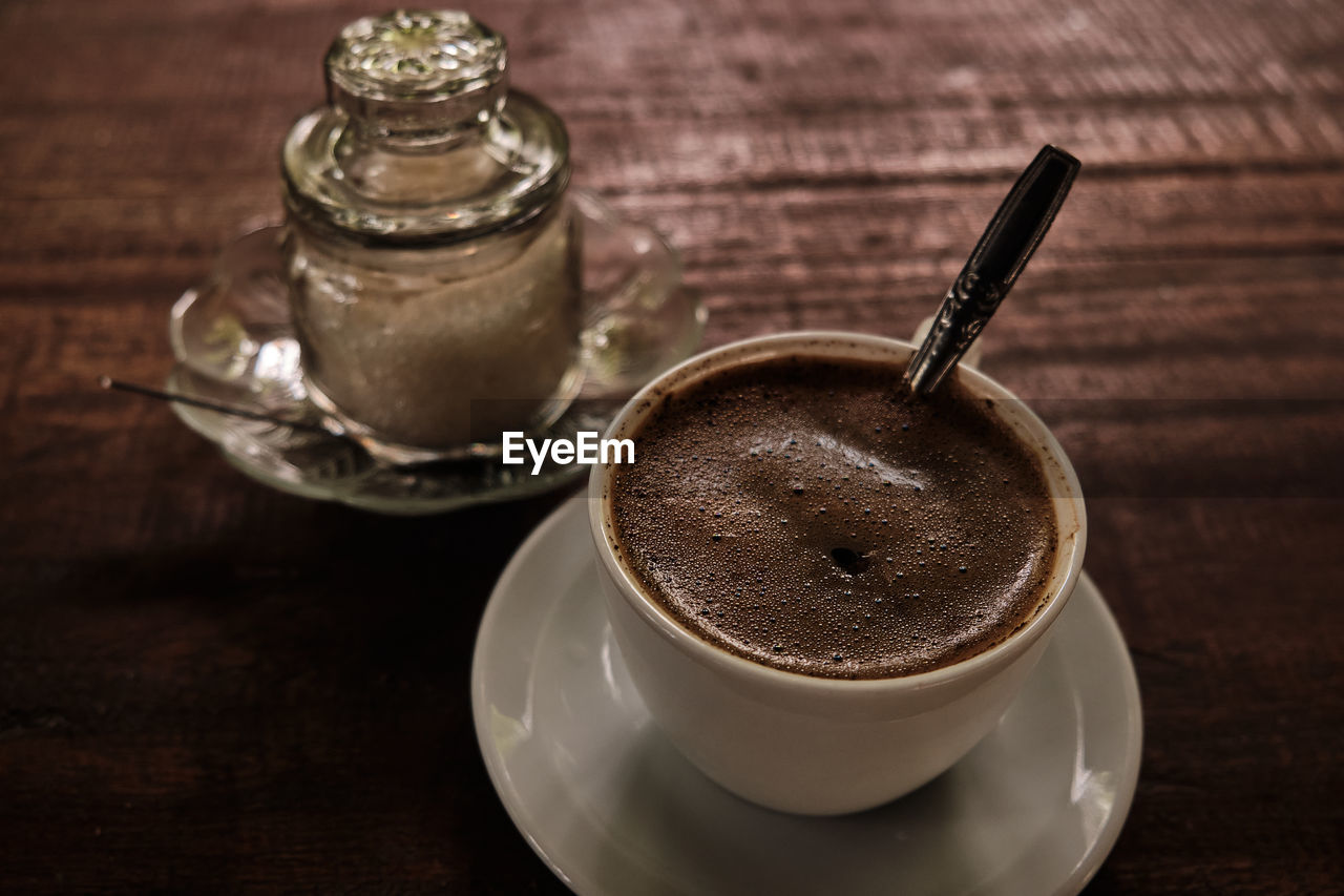 High angle view of coffee cup on table