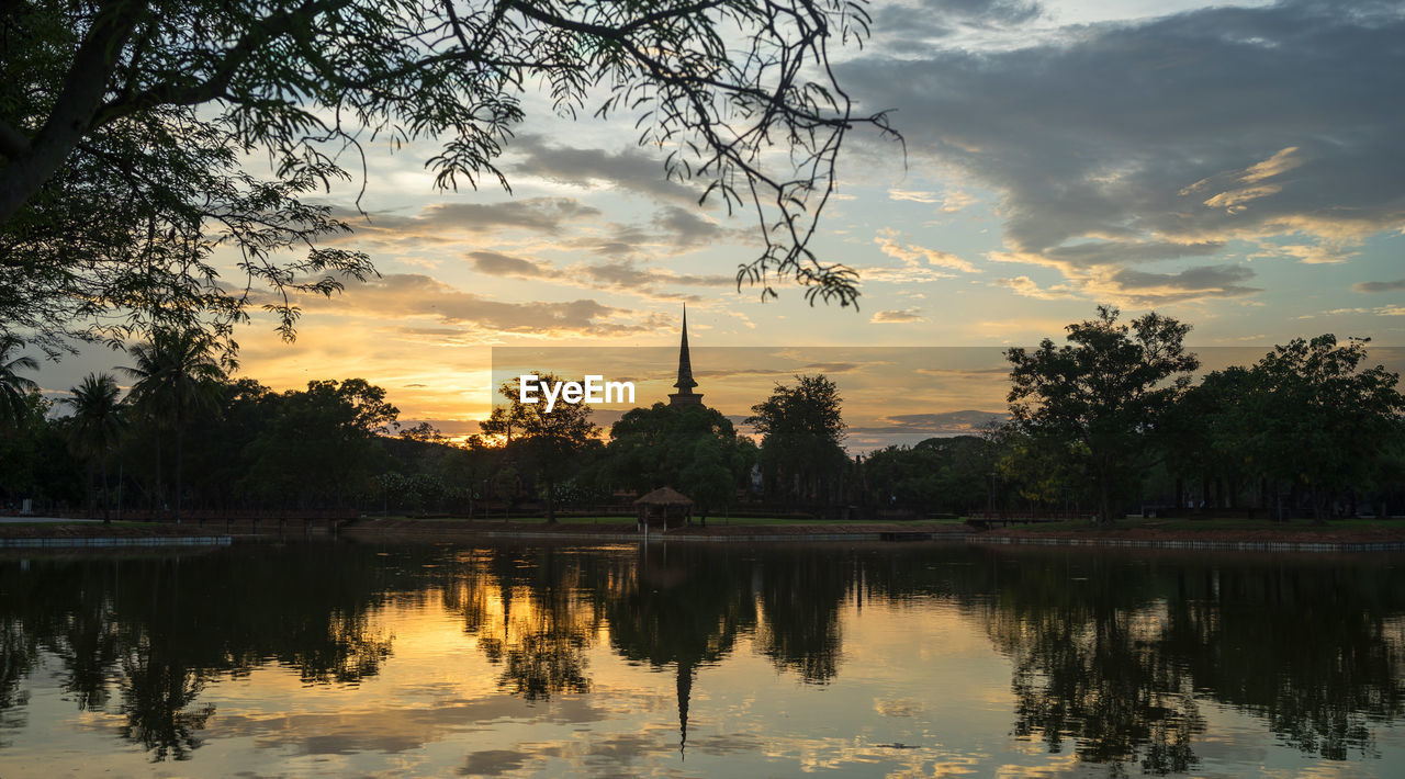 Scenic view of lake against sky during sunset