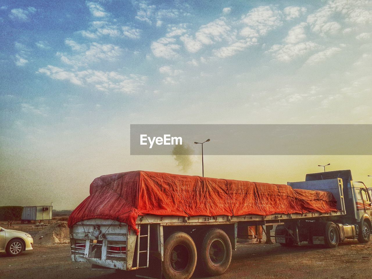 Semi-truck on road against sky