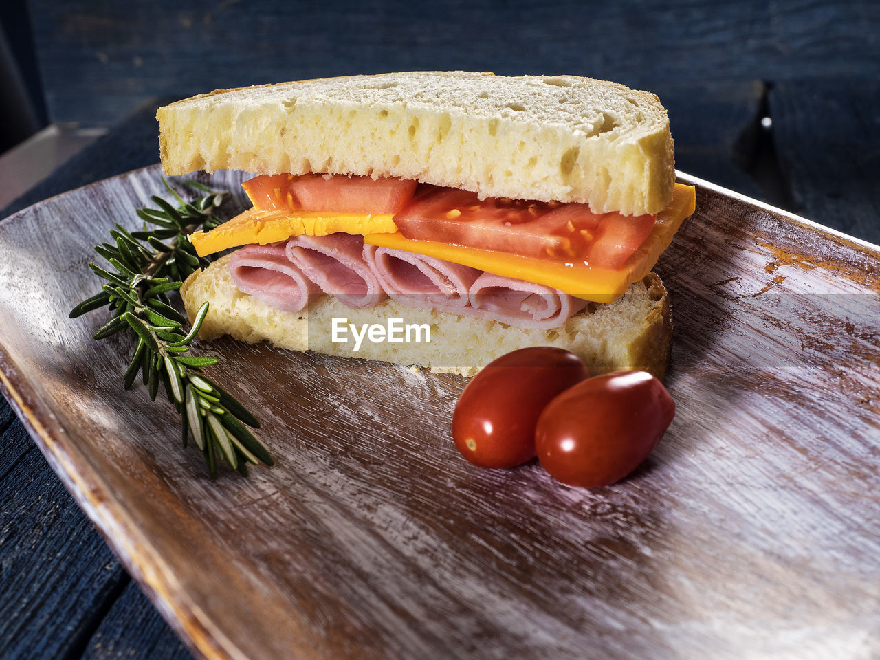 Close-up of sandwich on cutting board over table