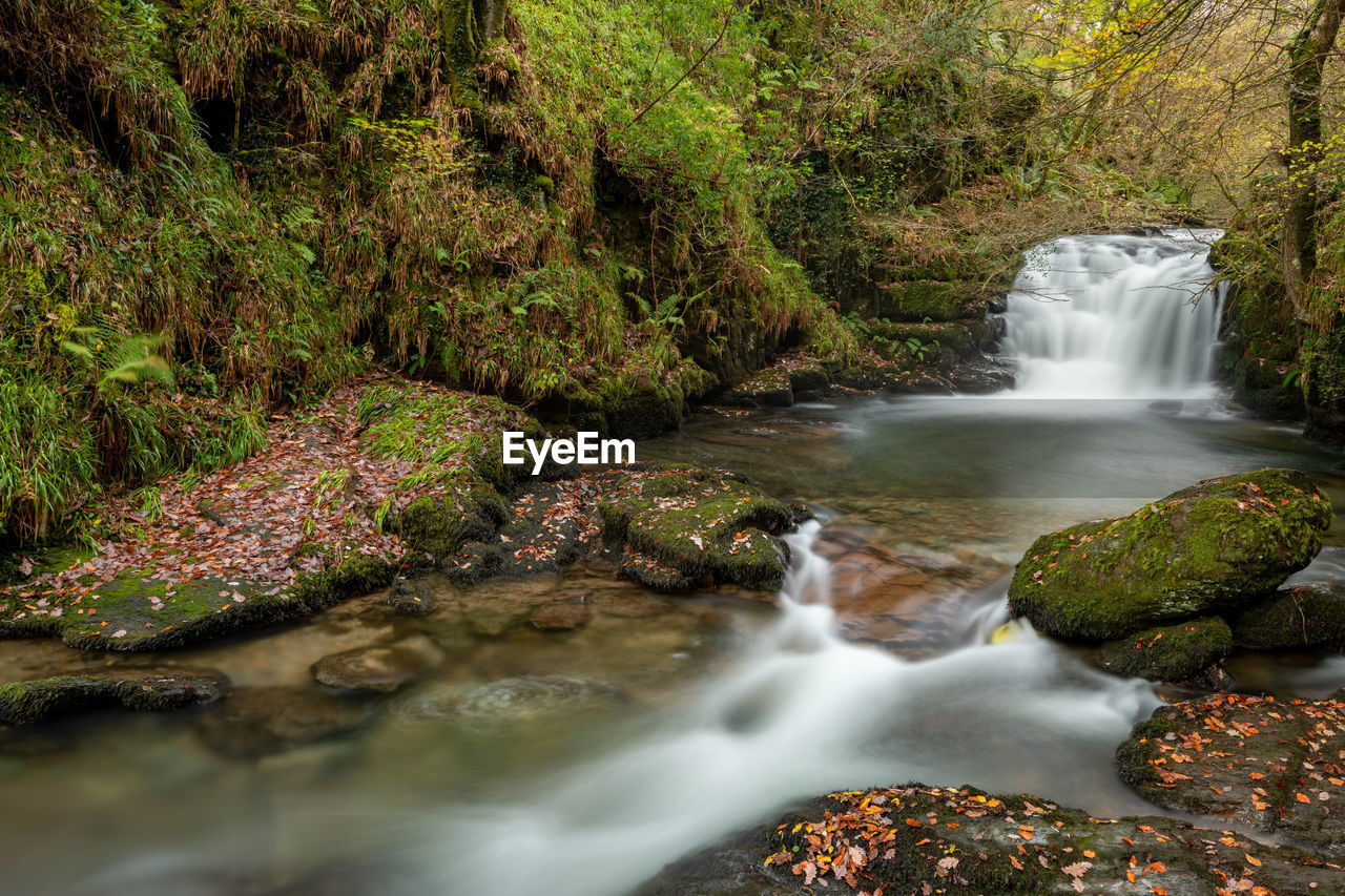 Long exposure of a the big waterfall at watersmmet in exmoor national park in autumn
