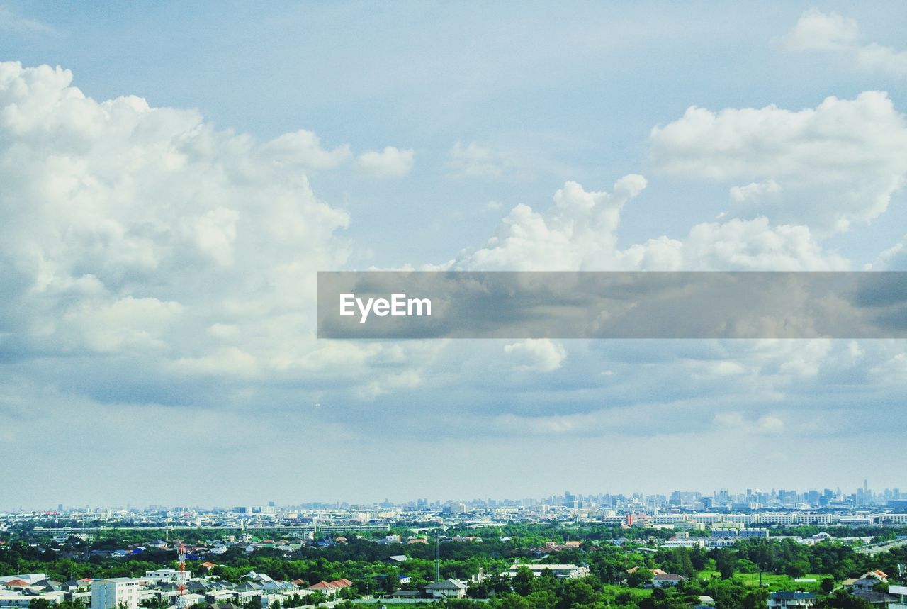 Aerial view of cityscape against sky