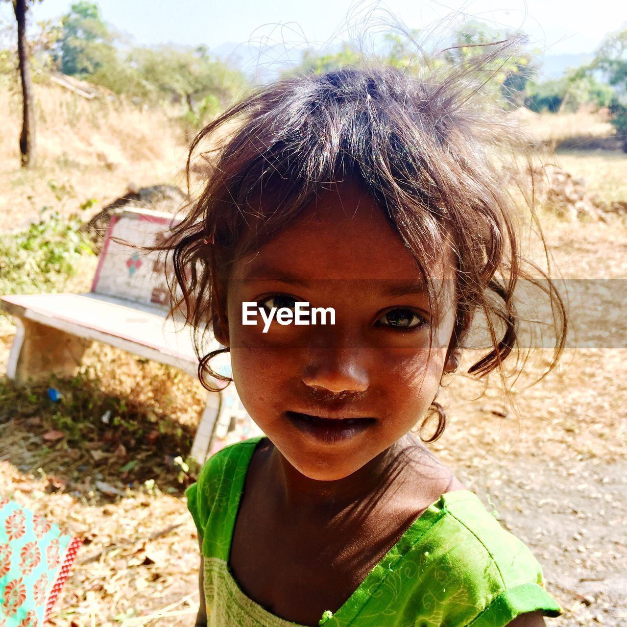 CLOSE-UP PORTRAIT OF SMILING GIRL WITH MOUTH OPEN