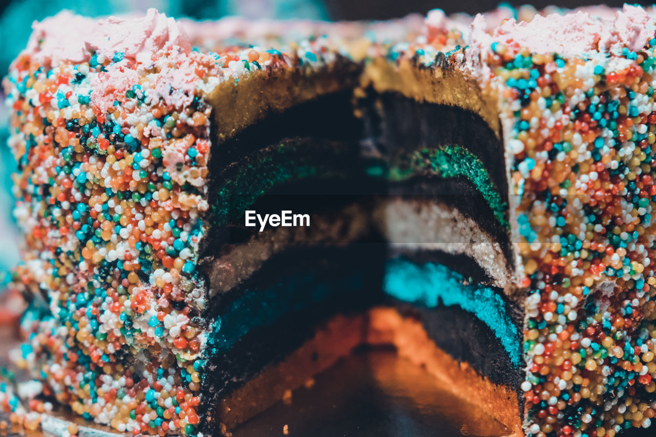 sweet food, sweet, food, multi colored, dessert, food and drink, temptation, cake, nonpareils, unhealthy eating, close-up, sprinkles, blue, no people, baked, birthday cake, icing, indoors, still life, sweetness, selective focus, freshness, variation, focus on foreground, chocolate