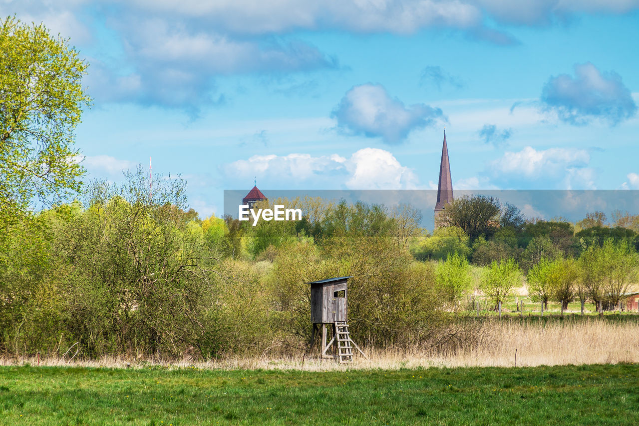 BUILT STRUCTURE ON LAND AGAINST SKY