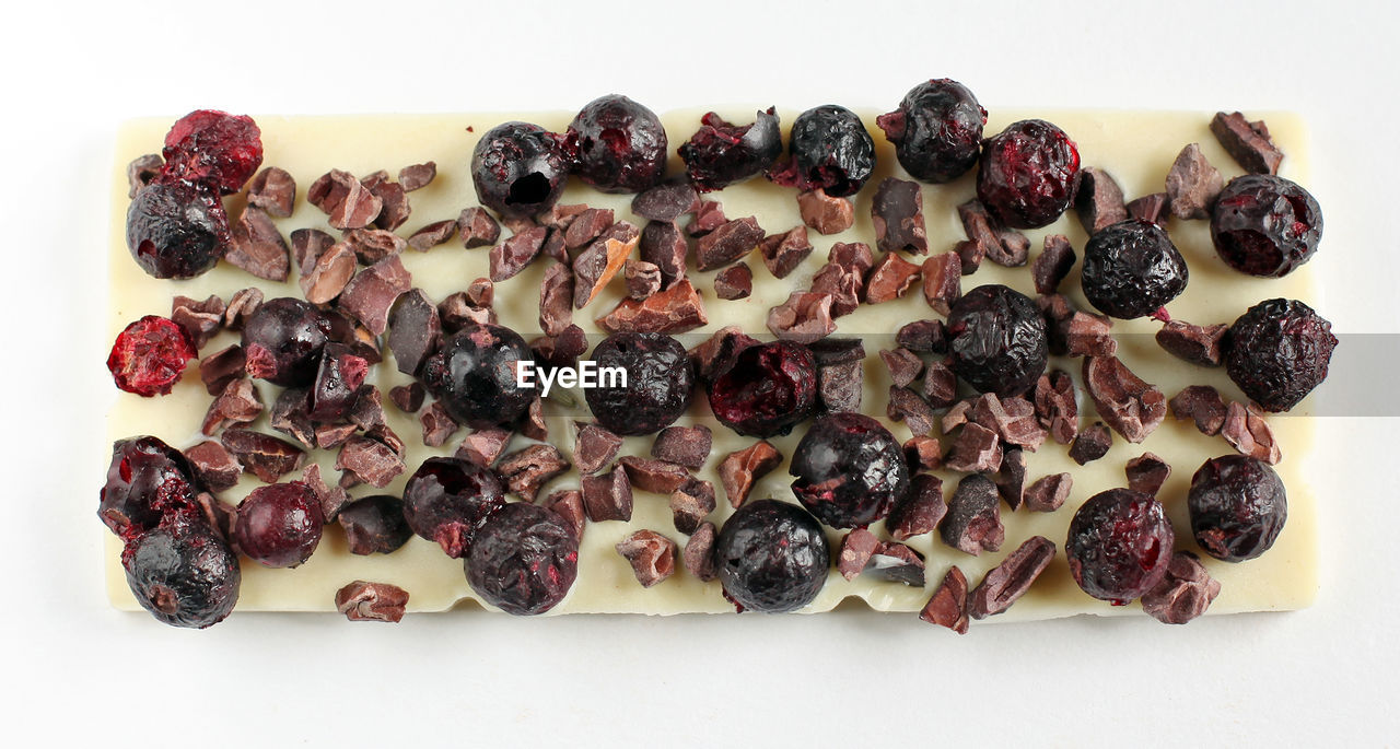 High angle view of handmade chocolates on white background