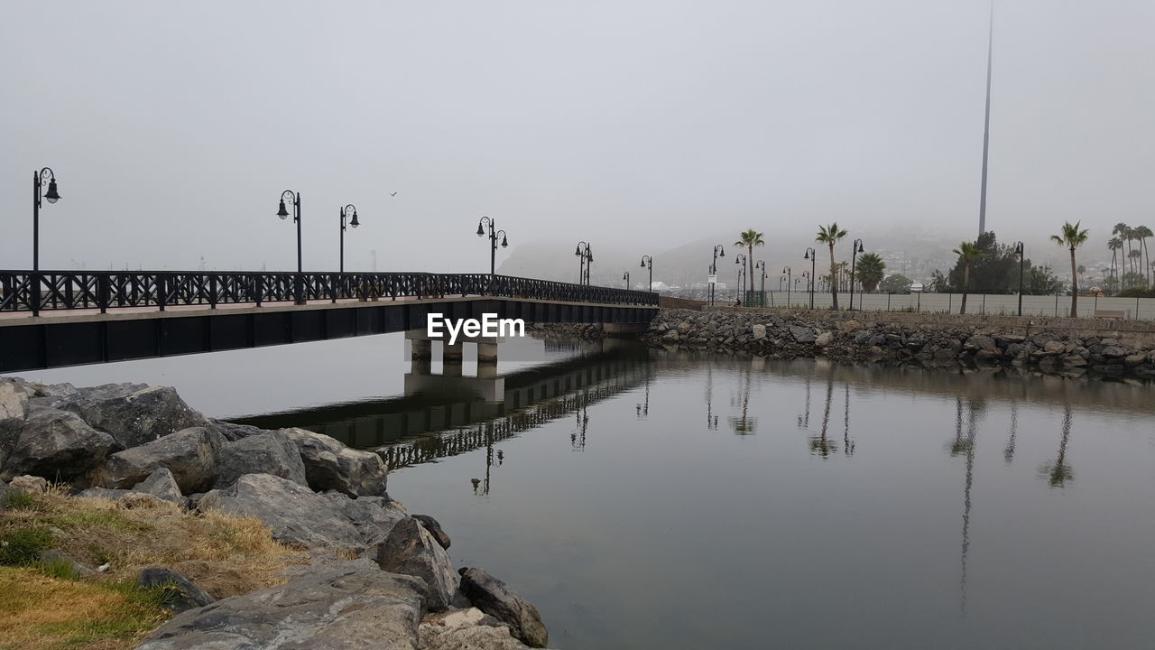 Bridge over river against clear sky