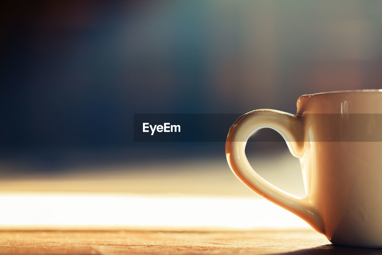 Close-up of coffee cup on table