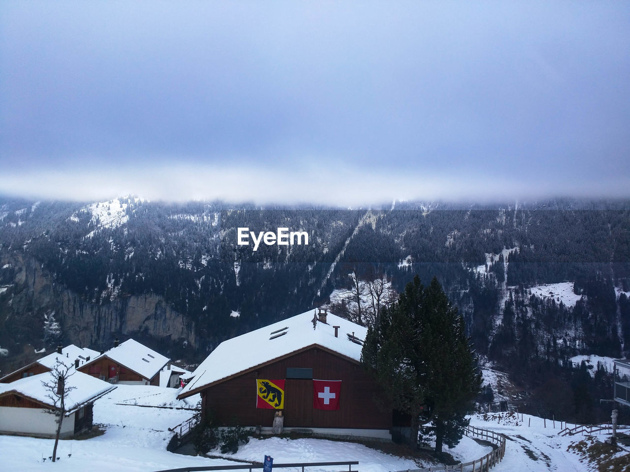 HOUSES AGAINST SKY DURING WINTER