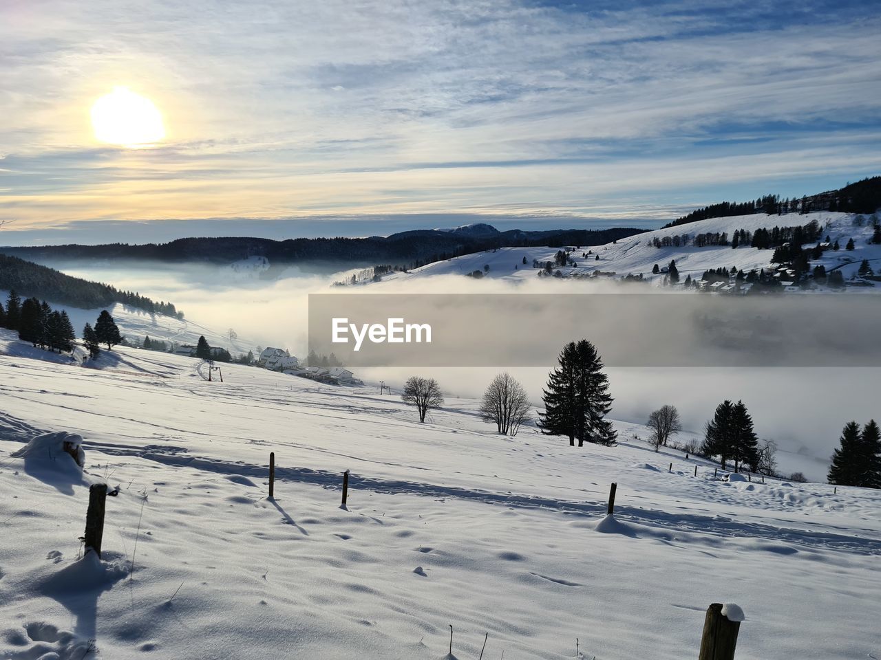 SCENIC VIEW OF SNOW COVERED LAND AGAINST SKY