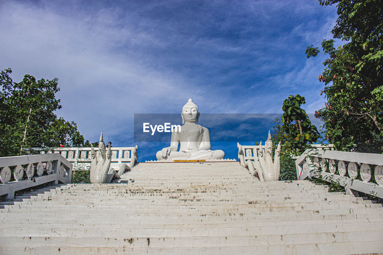 Low angle view of statue against sky