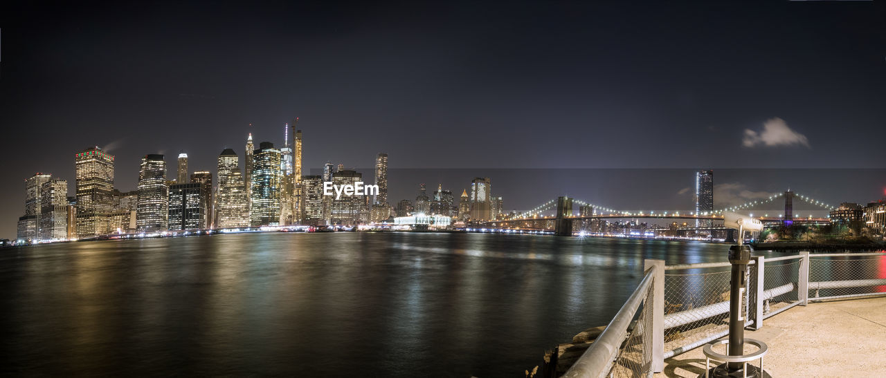 high angle view of illuminated buildings in city at night