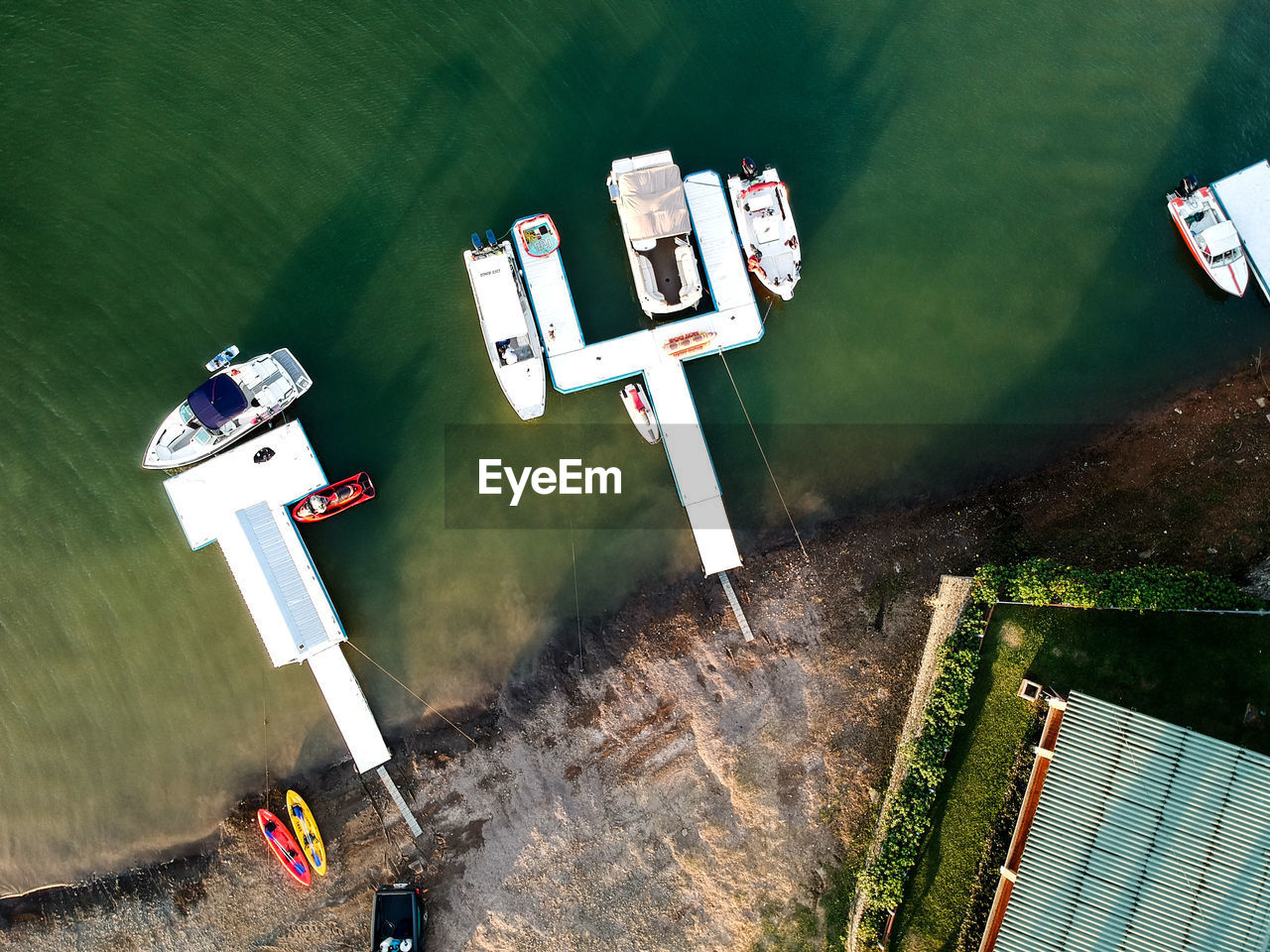 High angle view of helicopter flying over lake