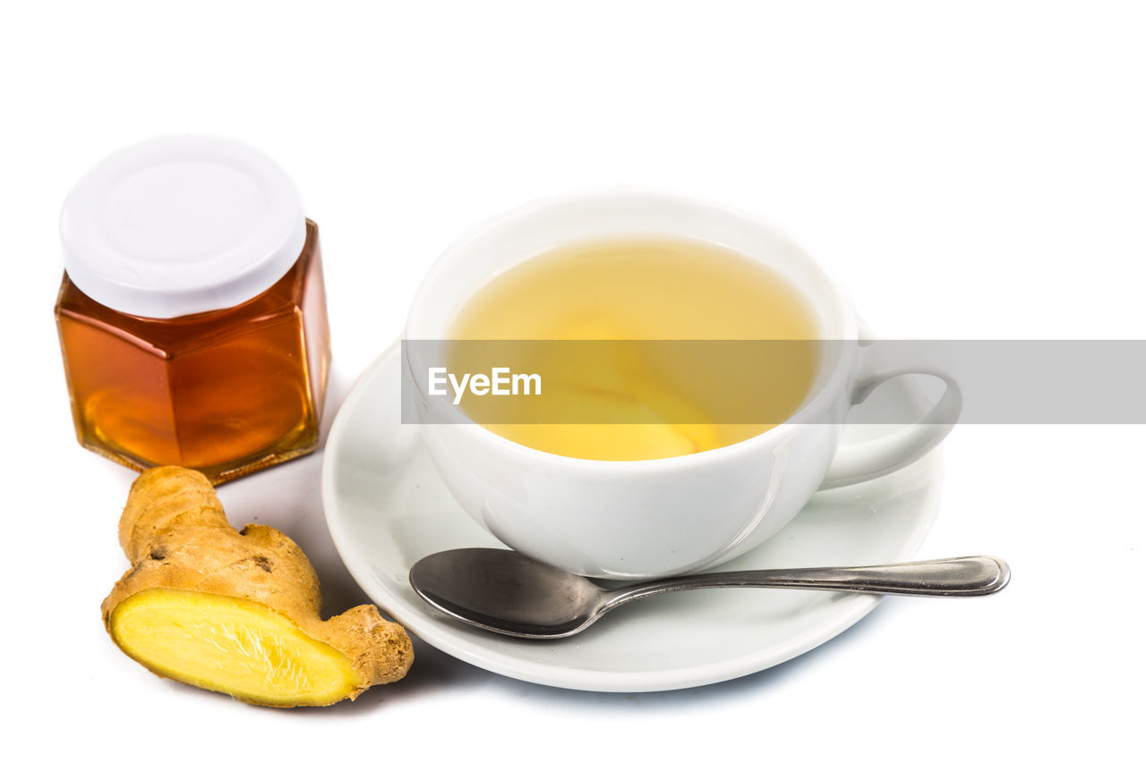 CLOSE-UP OF TEA CUP WITH WHITE BACKGROUND