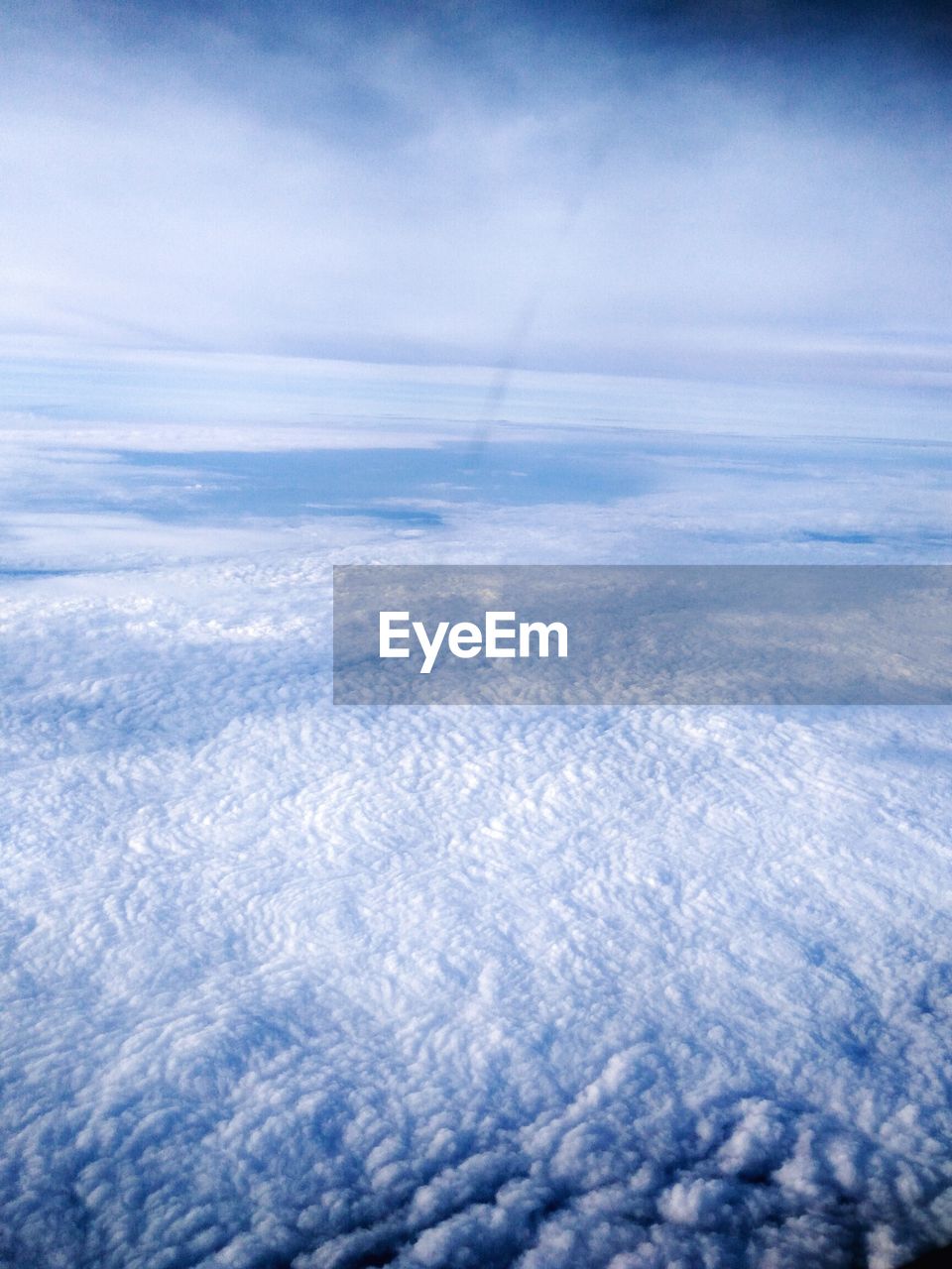 AERIAL VIEW OF CLOUDSCAPE OVER LANDSCAPE