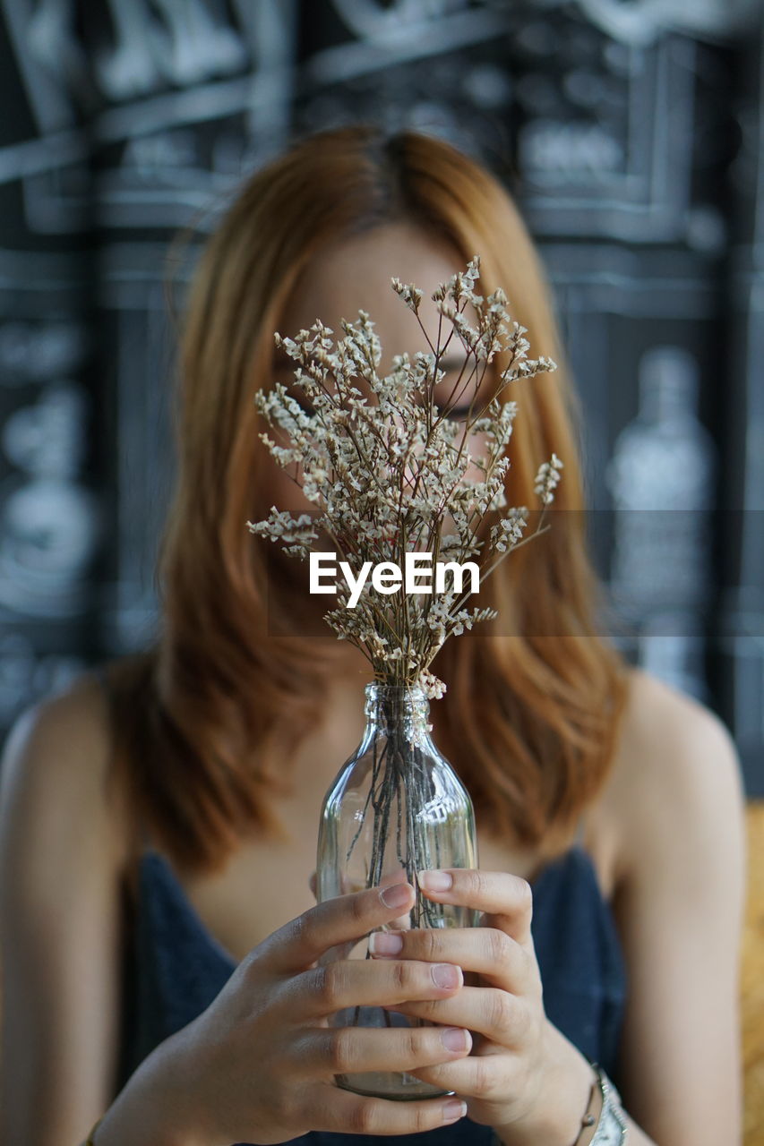 Woman holding flower