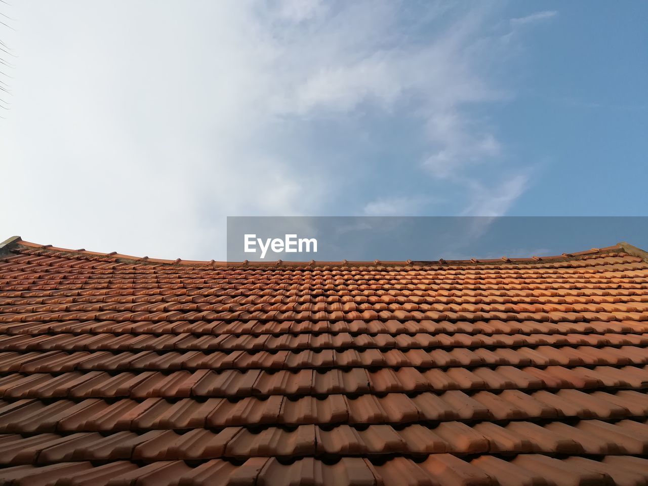 Low angle view of roof tile against sky