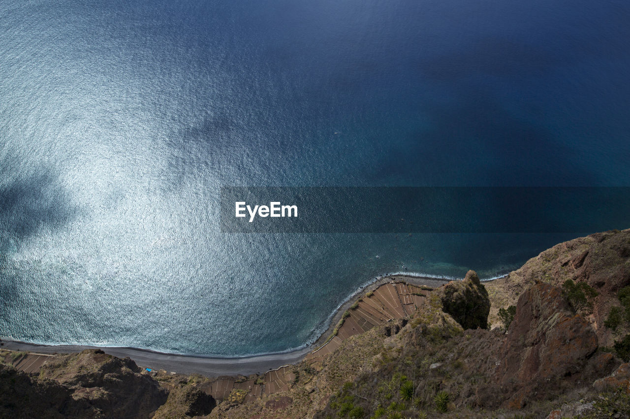 High angle view of mountain by sea