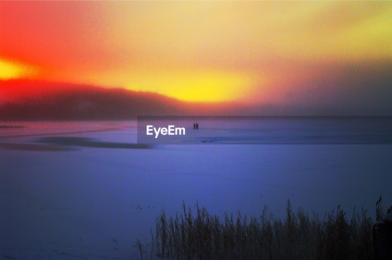 SCENIC VIEW OF SEA DURING SUNSET