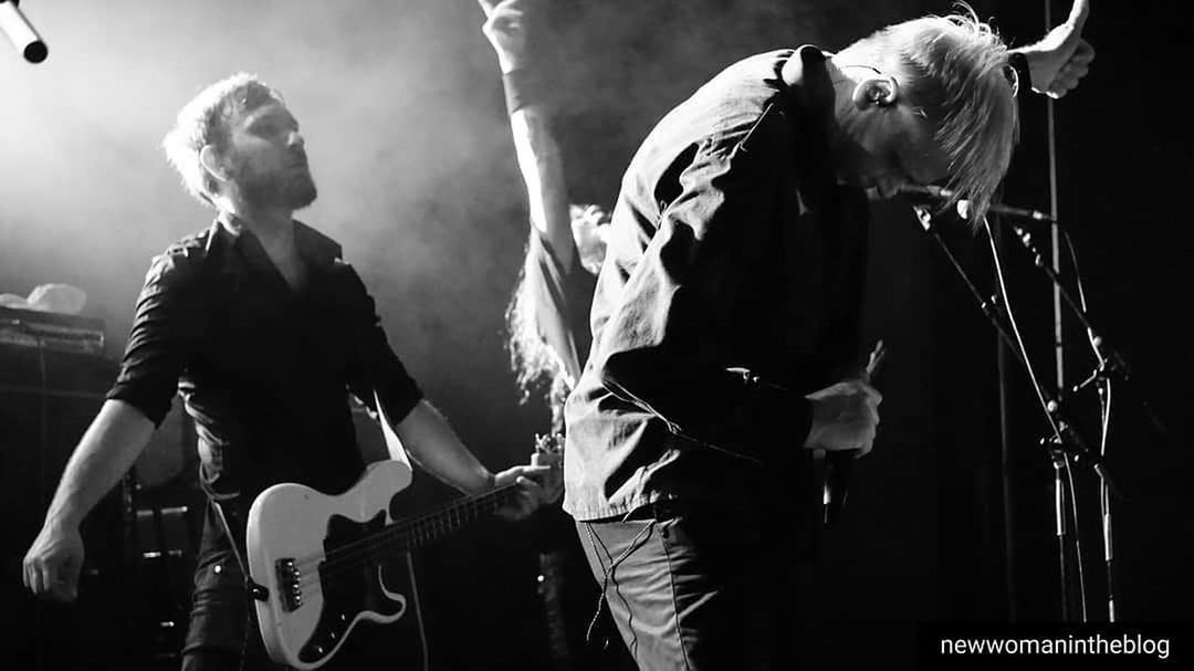 arts culture and entertainment, music, musician, performance, rock concert, black and white, stage, musical instrument, event, entertainment, rock music, black, concert, guitar, performing arts event, men, adult, performing arts, monochrome photography, electric guitar, musical equipment, monochrome, drummer, popular music concert, input device, two people, microphone, plucking an instrument, performance art, string instrument, enjoyment, crowd, festival, skill, nightlife, singing