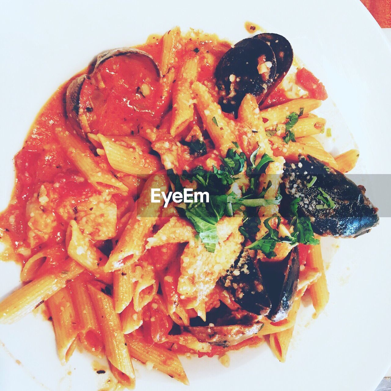 CLOSE-UP OF PASTA WITH SALAD IN PLATE