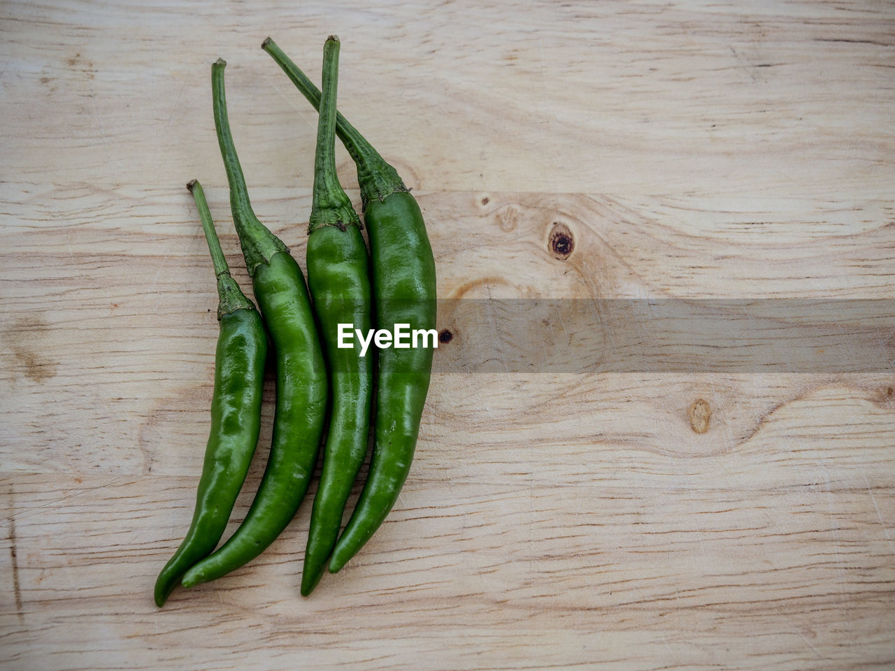 High angle view of green chili pepper on table