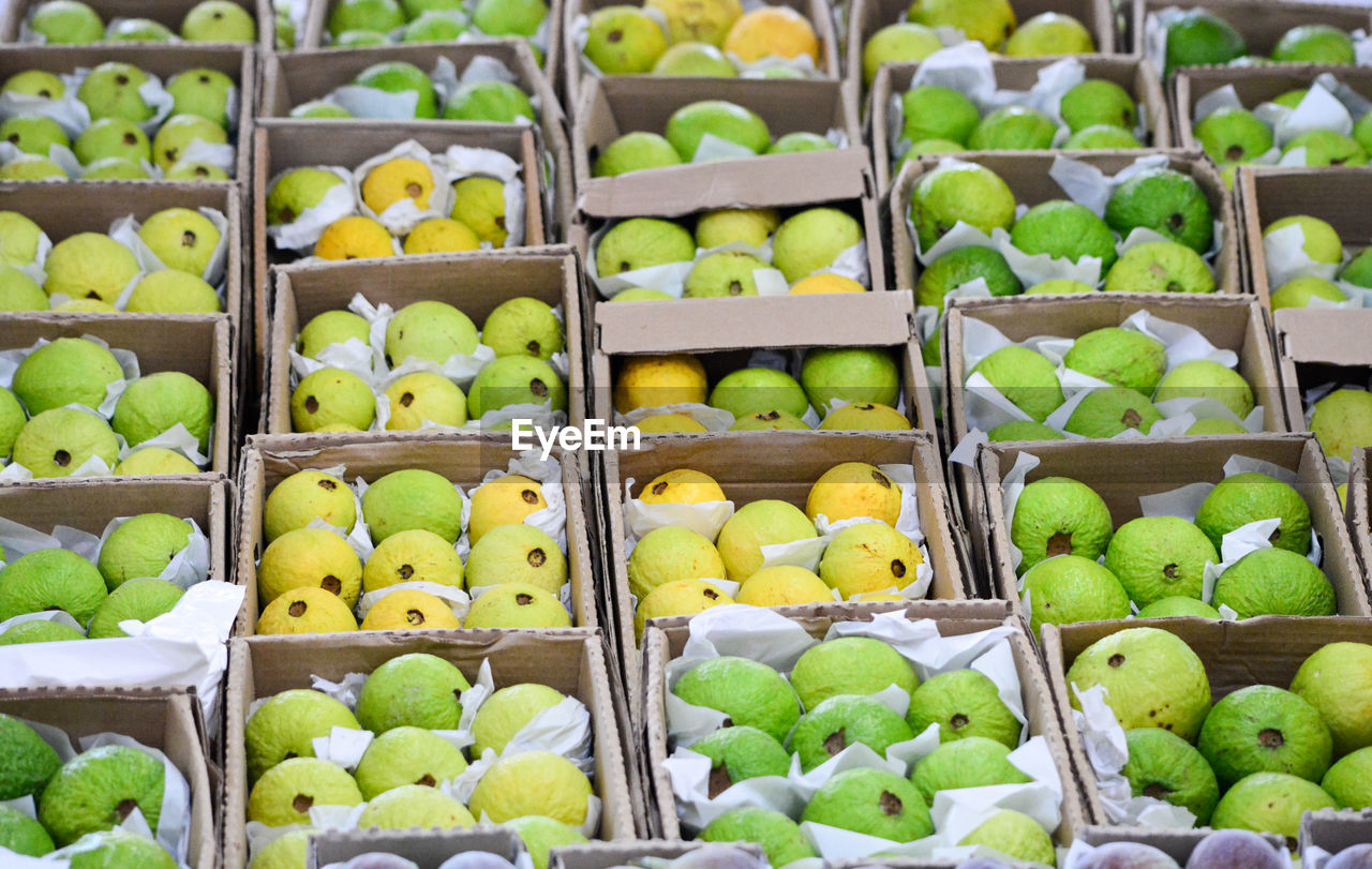 Full frame shot of guavas for sale at market stall