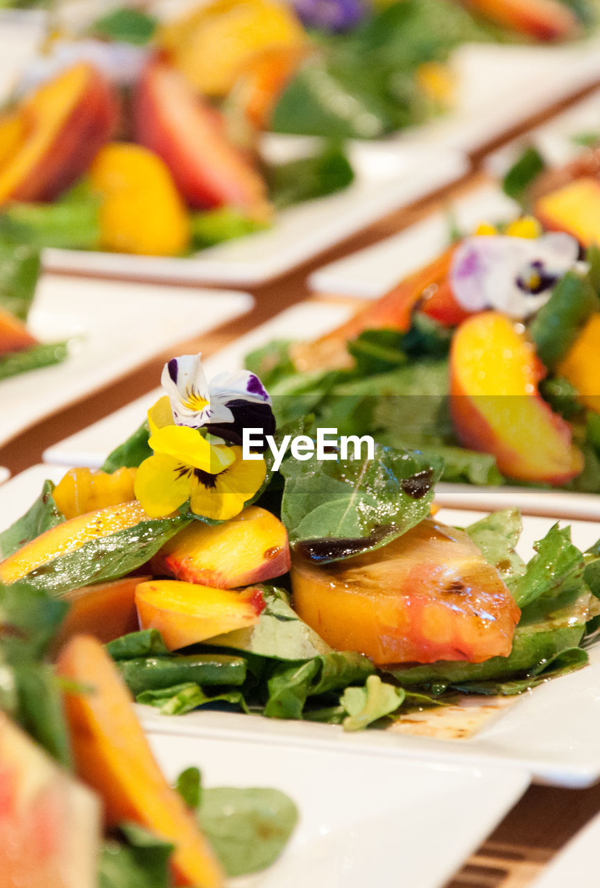 Close-up of chopped fruits on plate on a table